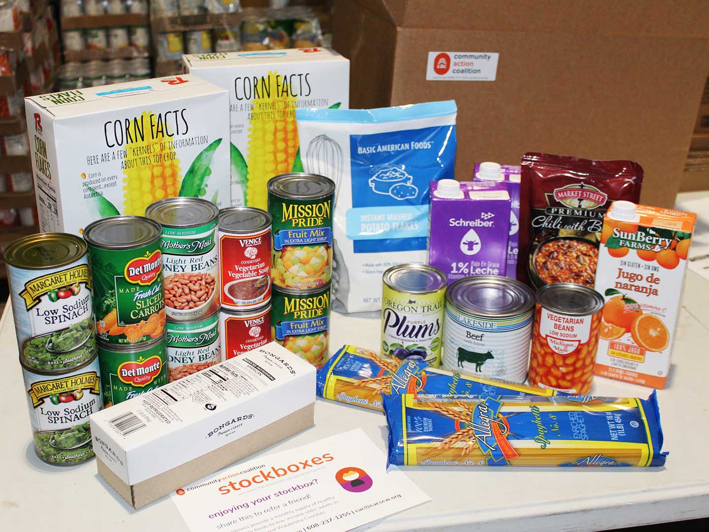 non-perishable food items displayed on table in front of a Stockbox